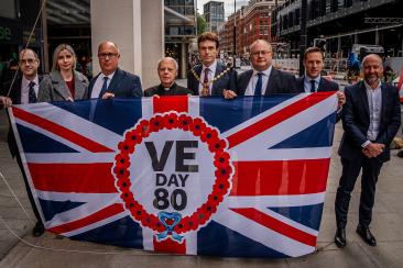 Cllr Adam Hug, Leader of Westminster City Council is joined by fellow councillors, members of the armed forces and the chaplain to Parliament to commemorate VE Day 80
