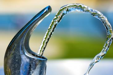 A water fountain with water pouring out