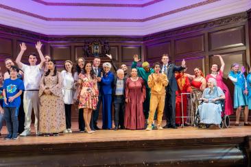 Dance Westminster's 2024 finalists posing for a group photo on stage joined by the celebrity judges, our Lord Mayor and CEO of Step Change Studios.  