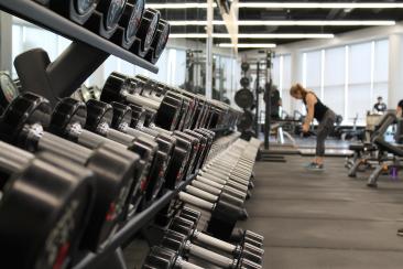 Woman lifting weights in a gym