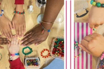 Hands modelling self-made beaded jewellery.