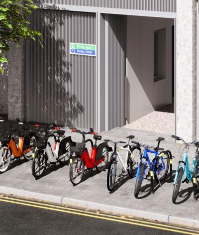 A CGI example of dockless bike parking on a pavement between two black arched barriers with a bike symbol on them