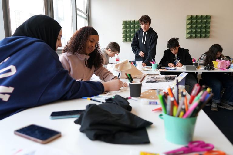 Young people taking place in an art and crafts session 