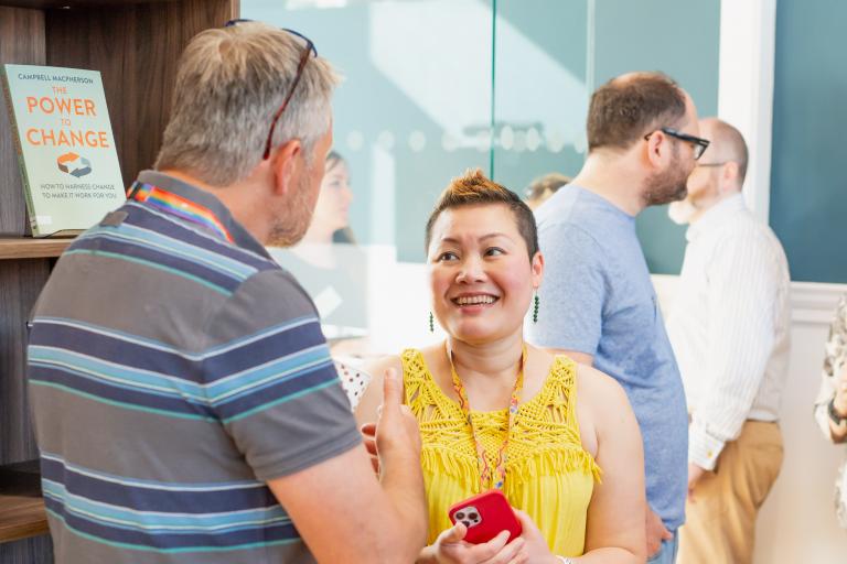 Two people talking at an event in one of our libraries