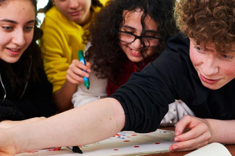 image of laughing children drawing