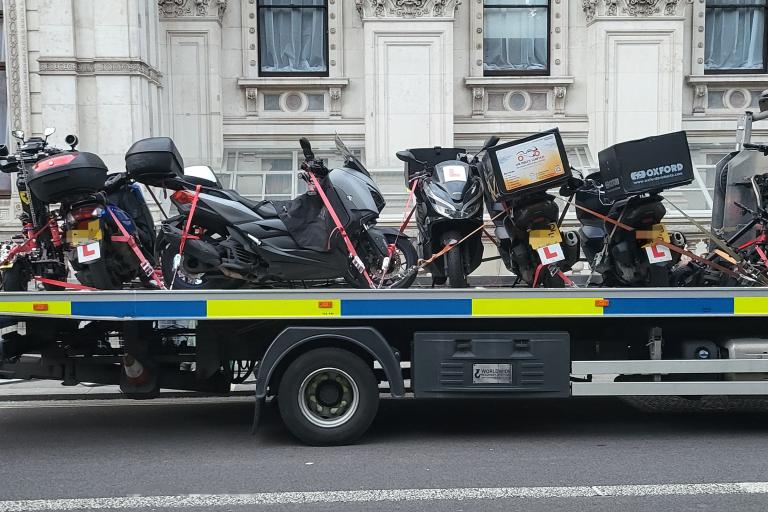 A police flatbed truck with seized Motorbikes 