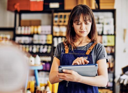 Female business owner standing in front of her product