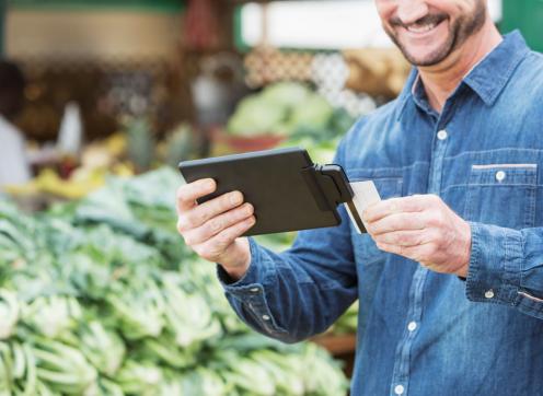 man holding card reader