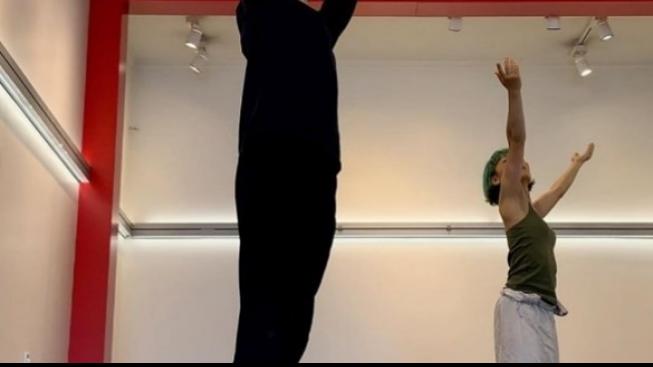 Two people dancing in a dance studio