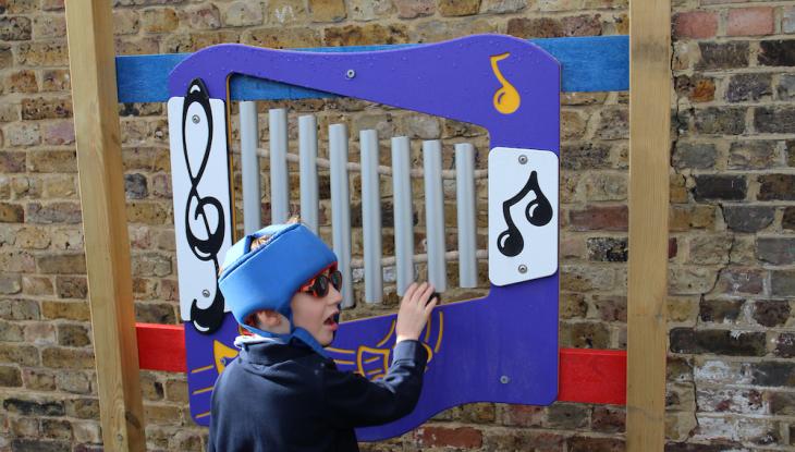 young boy playing outside