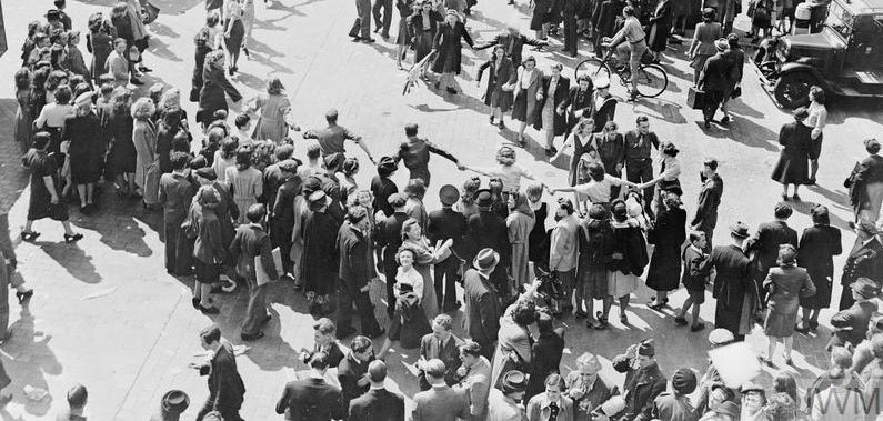 Crowds dancing in Oxford Circus, London.